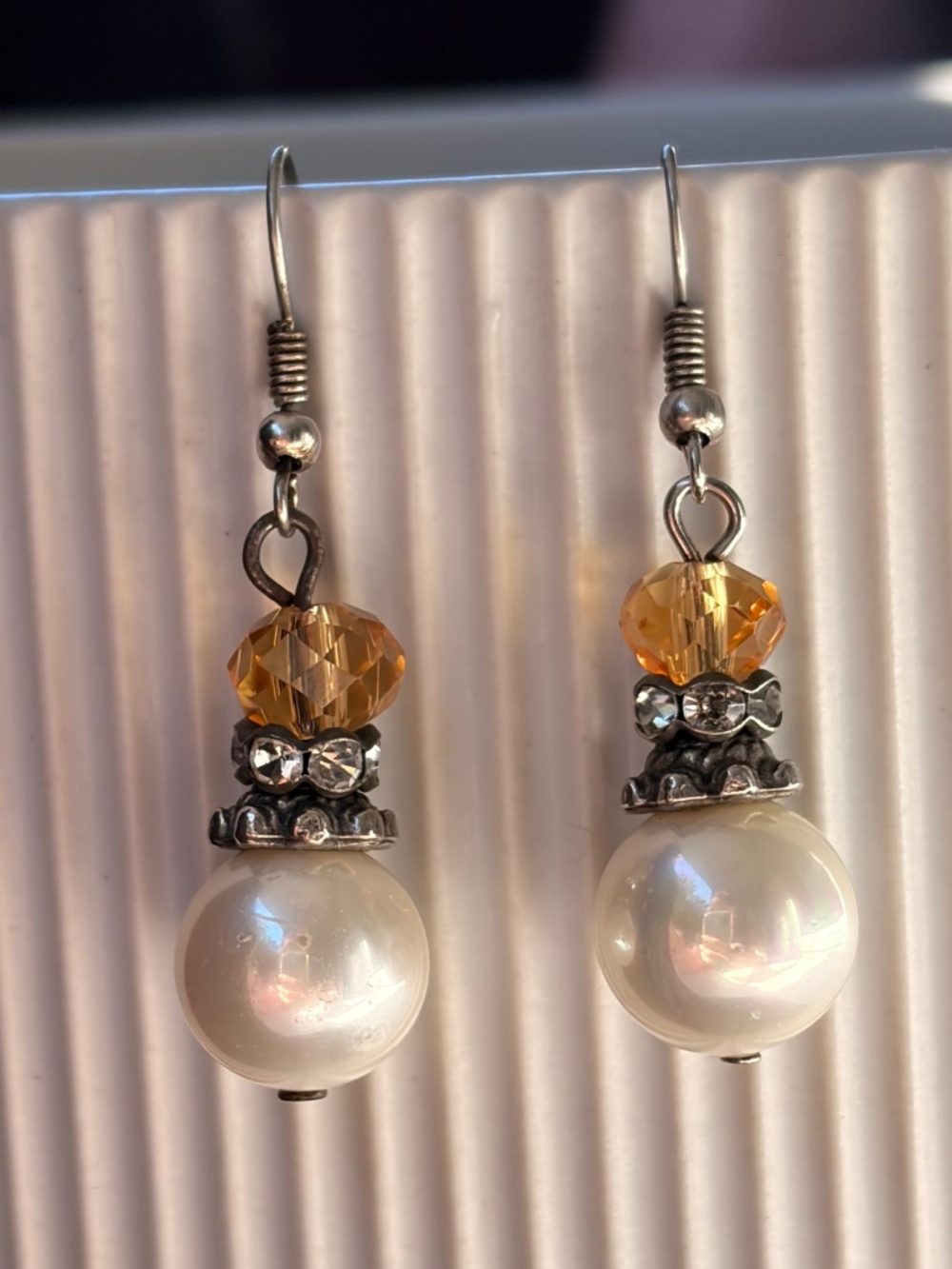 Artisnal earrings with faux pearls and topaz.